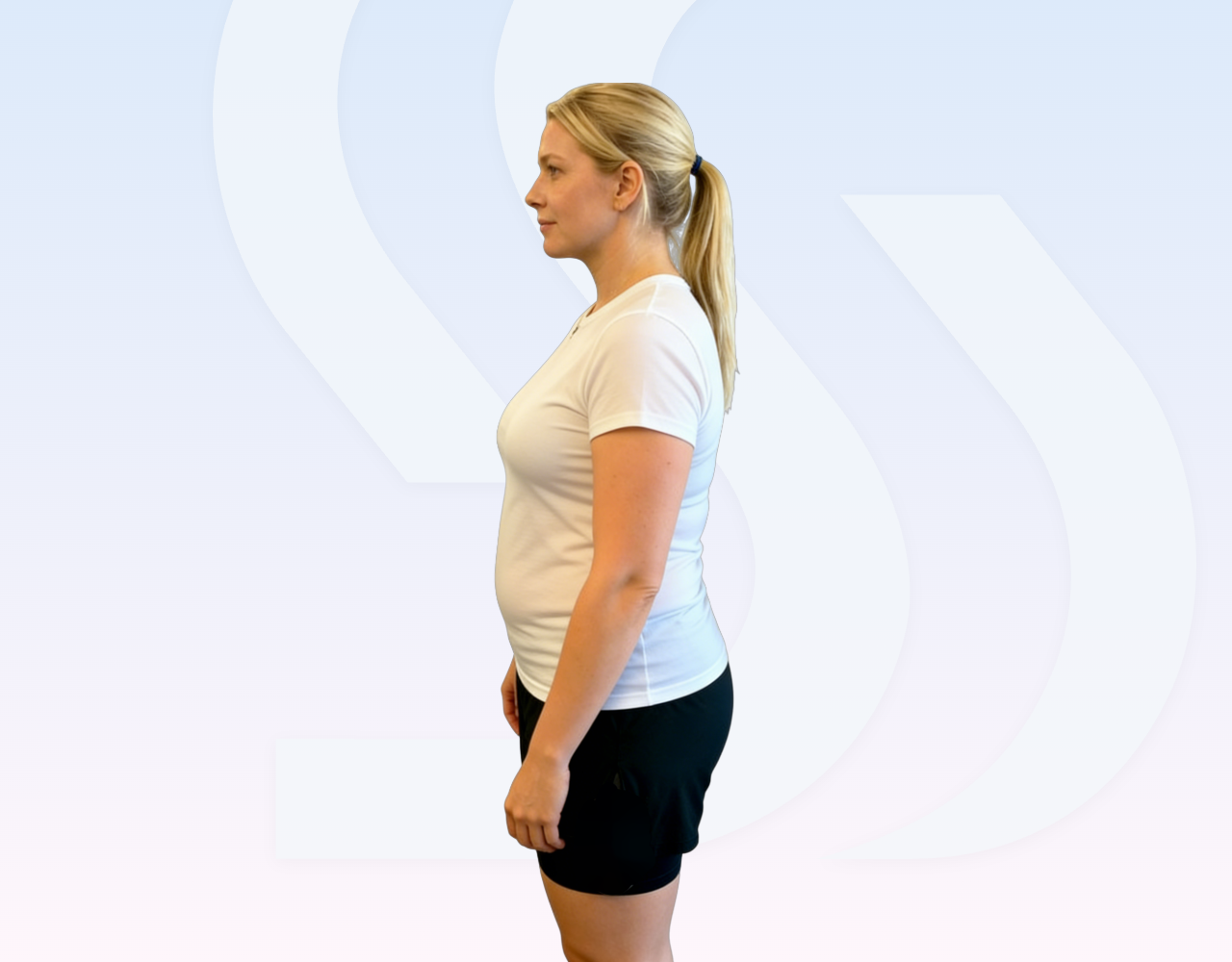 Standing side profile of a woman in a white shirt and black shorts on a pale branded background for comparison.